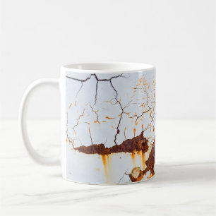 Cracked white paint, rusty car. coffee mug