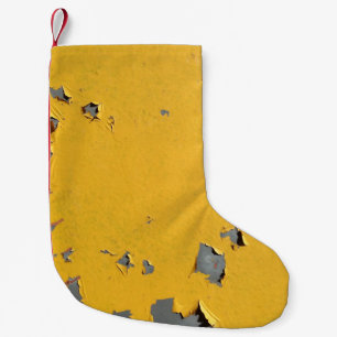 Cracked yellow metal: dirty texture. small christmas stocking