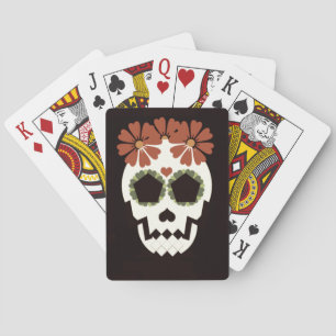Crâne avec des cartes de jeu de fleurs