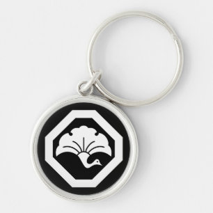 Crane-shaped ginkgo leaf on tray keychain