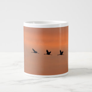 Cranes at sunrise large coffee mug