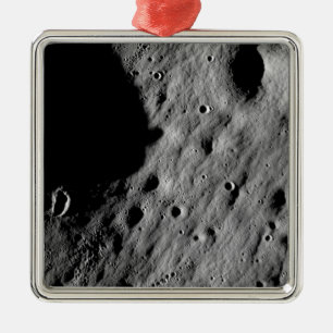 Cratered regions metal ornament