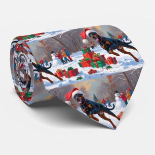 Cravate Doberman courant dans la neige avec un chapeau de