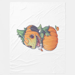 crazy pumpkin trying to eat spooky fleece blanket