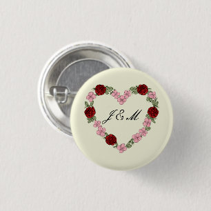Cream badge with a pink and red heart 1 inch round button