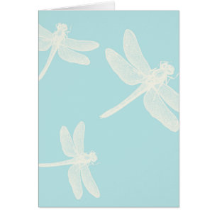 Cream Dragonflies on Teal Blue Background