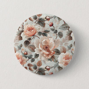 Cream flowers with grey leaves on a light grey 2 inch round button