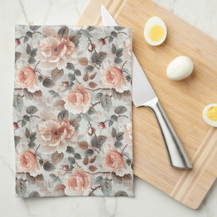 Cream flowers with grey leaves on a light grey kitchen towel