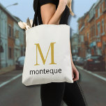 Cream Luxury Personalized Monogram Gift For Her Tote Bag<br><div class="desc">Personalized Tote Bag featuring a large gold monogram in Playfair Display with a refined last name underneath in Montserrat. The soft cream background keeps the design clean and elegant. A timeless luxury gift for her,  perfect for everyday use,  bridal parties,  or a chic minimalist wardrobe.</div>