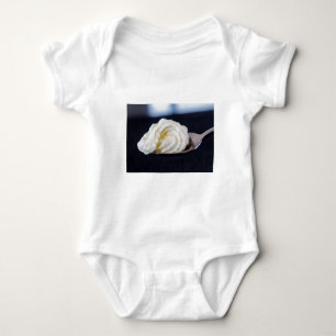 cream on a spoon macro concept baby bodysuit