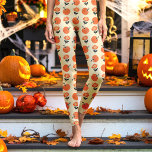 Cream Vintage Pumpkins and Flowers Halloween Leggings<br><div class="desc">Celebrate Halloween in style with these Cream Vintage Pumpkins and Flowers Halloween Leggings. Featuring a delightful mix of orange pumpkins and charming flowers on a soft cream background, these leggings exude a nostalgic fall feel, perfect for the spooky season. Comfortable, stylish, and great for any casual occasion, these leggings are...</div>