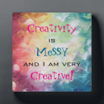 Creativity is messy and i am very creative plaque<br><div class="desc">Text says creativity is messy and i am very creative. An abstract painting using thick expressive brushstrokes with a lot of motion and movement. Lots of heavy paint in blues, yellows, reds, orange and green. An artistic and creative style. An inspirational and funny quote / reminder for artistic and creative...</div>