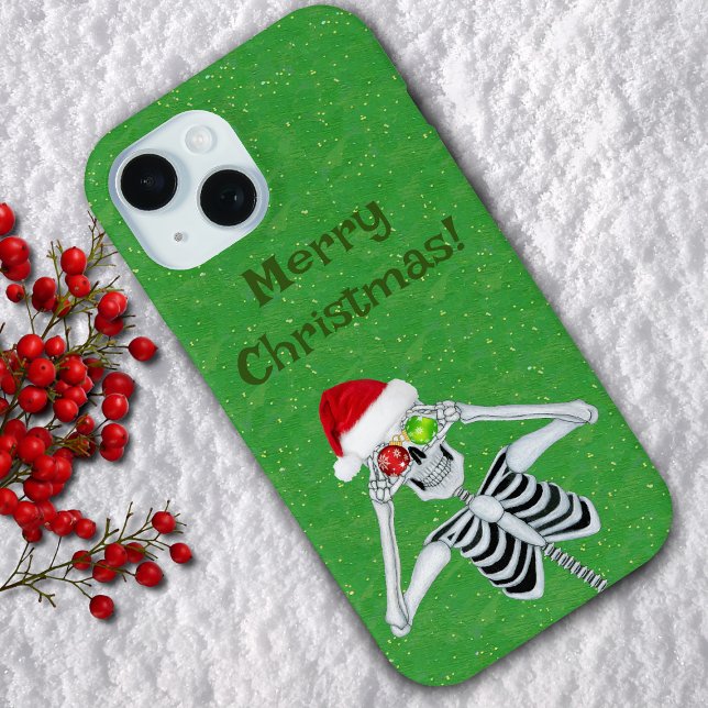 Creepmas Skeleton Santa Hat Ornaments on Green Case-Mate iPhone Case (Fun Skeleton Holding Red and green ornaments to eyes on green with gold flecks cell phone case.)