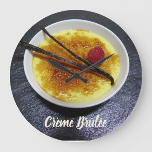 Creme brulee on slate with raspberry and vanilla l large clock