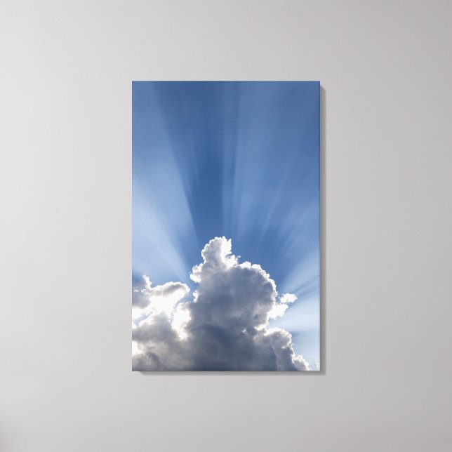 Crepuscular or God's rays streak past cloud. Canvas Print (Front)