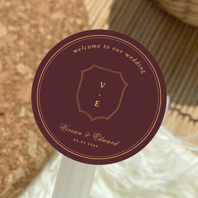 Crest Monogram Burgundy & Gold Wedding Welcome Classic Round Sticker (Creator Uploaded)