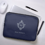 Crest Navy Blue Vintage Elegant Monogram and Name Laptop Sleeve<br><div class="desc">A navy blue and silver design with the monogram initial in a vintage crest, recommended for a man. The crest is faux silver foil, the background is navy blue. Under the crest there is the name in grey caps. The vintage floral crest from an old book cover binding, of the...</div>