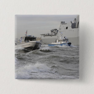 Crews from the coast guard and police departmen 2 inch square button