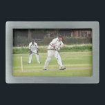 CRICKET BELT BUCKLE<br><div class="desc">A simple art design of a Sunday afternoon village cricket match.</div>