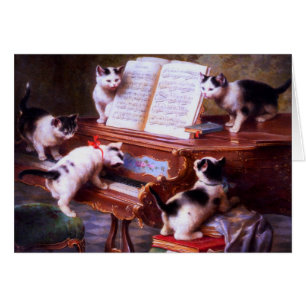 Cru - chatons au jeu sur un piano,