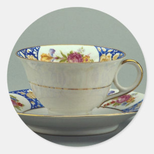 Cup and saucer with colourful flower designs on it classic round sticker