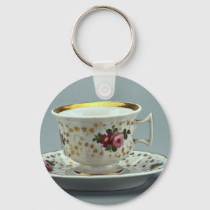 Cup and saucer with colourful flower designs on keychain