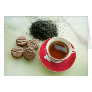 Cup of black tea with chocolate biscuits
