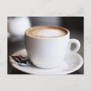 cup of coffee latte on table, close-up postcard