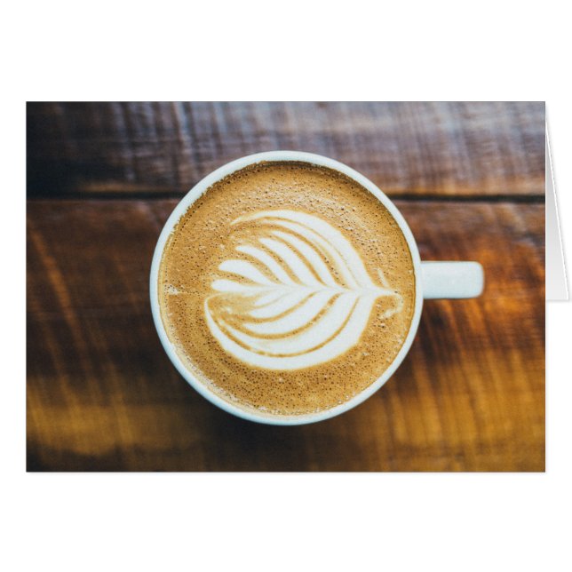 Cup of Coffee Latte with Leaf-Shape Foam on Wood (Front Horizontal)