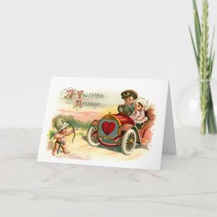 Cupid's Arrow Points at Couple in Car Holiday Card