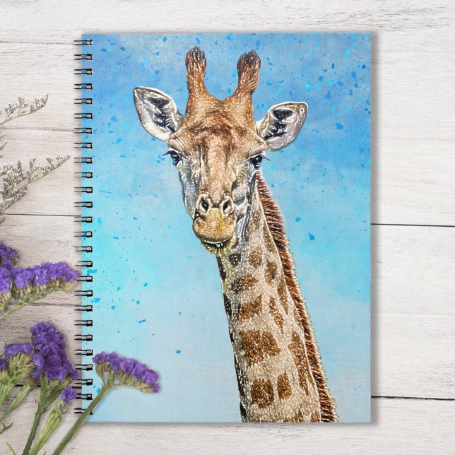 Curious Giraffe with Blue Confetti Sky Notebook (Sky Blue Notebook with Smiling Giraffe on Tabletop with purple flowers)