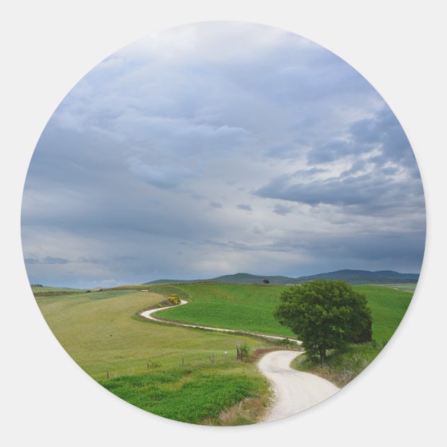 Curvy road towards a destination round sticker (Front)