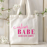 Custom Babe Funny Saying Personalized Name Tote Bag<br><div class="desc">Custom Babe Funny Saying Personalized Name Tote Bags features a simple design with the text "custom babe" in modern pink calligraphy script typography and personalized with your name. Perfect for a fun gift for mom, best friends, girlfriend, for birthday, Christmas, holidays, Mother's Day and more. Designed by Evco Studio www.zazzle.com/store/evcostudio...</div>