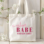 Custom Babe Funny Saying Personalized Name Tote Bag<br><div class="desc">Custom Babe Funny Saying Personalized Name Tote Bags features a simple design with the text "custom babe" in modern pink calligraphy script typography and personalized with your name. Perfect for a fun gift for mom, best friends, girlfriend, for birthday, Christmas, holidays, Mother's Day and more. Designed by Evco Studio www.zazzle.com/store/evcostudio...</div>