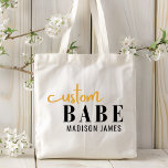 Custom Babe Funny Saying Personalized Name Tote Bag<br><div class="desc">Custom Babe Funny Saying Personalized Name Tote Bags features a simple design with the text "custom babe" in modern black and gold calligraphy script typography and personalized with your name. Perfect for a fun gift for mom, best friends, girlfriend, for birthday, Christmas, holidays, Mother's Day and more. Designed by Evco...</div>