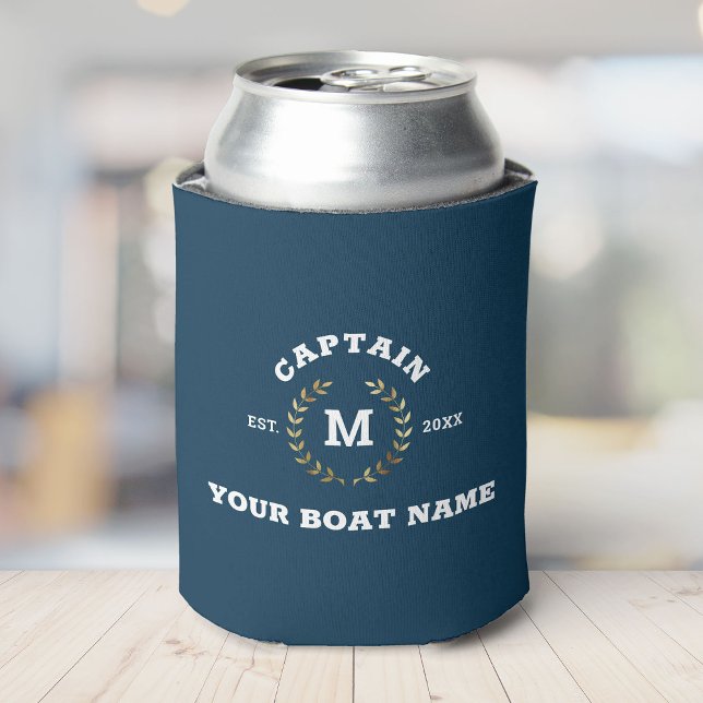 Custom Boat Captain Monogram Gold Laurel Nautical Can Cooler (A blue drink koozie with "CAPTAIN YOUR BOAT NAME EST. 20XX" and an "M" surrounded by laurel leaves)