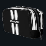Custom Cool Black And White Auto Race Sport Stripe Dopp Kit<br><div class="desc">Classy white dual racing car stripes pattern design on a black background. Customize with name, monogram, initials, or (limited) text of your choice. Designed for the stylish race car sport, Nascar, Indy 500, Le Mans or Grand Prix racing fan, the lover or owners of classic cars, muscle cars, hot rods,...</div>