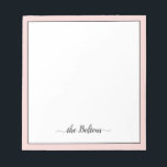Custom Family Name Elegant Pink White Stationery Notepad<br><div class="desc">Custom family name stationery notepad featuring pink frame and elegant black script calligraphy with swashes, on white background. Easily personalize with your surname and favorite colors.</div>