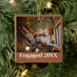 Custom First Christmas Engaged Couple Picture Ceramic Ornament<br><div class="desc">Introducing our "Custom First Christmas Engaged Couple Picture Terracotta Christmas Ornament, " a warm and personalized keepsake to celebrate this special milestone in your life. This finely crafted terracotta ornament allows you to commemorate your first Christmas as an engaged couple by adding your cherished picture, creating a unique and beautiful...</div>