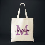 Custom Monogram Name Purple Tote Bag<br><div class="desc">Custom Monogram Name Purple Tote Bag. Elegant monogram logo design with monogrammed letter initials in a grunge font and name in dark purple script font. Easily replace the template monogram initials and the name with your own.Cute gift idea for all at a wedding specially for bride and bridesmaids or close...</div>