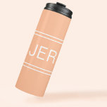 Custom Monogrammed Initials Drink Travel Peach Thermal Tumbler<br><div class="desc">Three Initial Monogrammed thermal tumblers are timeless, classic and stylish. Perfect for hot and cold beverages! Our Unique design is the perfect personalized gift for that special occasion. Shop our integrated collection of coordinating colours and golf - sports accessories. Custom personal monogrammed initials are added to a trendy peach background...</div>