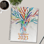 Custom Name 2023 Planner<br><div class="desc">This unique Planner is decorated with a brightly coloured mosaic tree. Customize it with your name and year. To edit further use the Design Tool to change the font, font size, or colour. Because we create our artwork you won't find this exact image from other designers. Original Mosaic © Michele...</div>