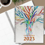Custom Name 2023 Planner<br><div class="desc">This unique Planner is decorated with a brightly coloured mosaic tree. Customize it with your name and year. To edit further use the Design Tool to change the font, font size, or colour. Because we create our artwork you won't find this exact image from other designers. Original Mosaic © Michele...</div>