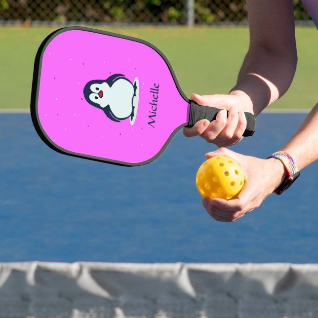 Custom name cute penguin on pink pickleball paddle (Insitu)