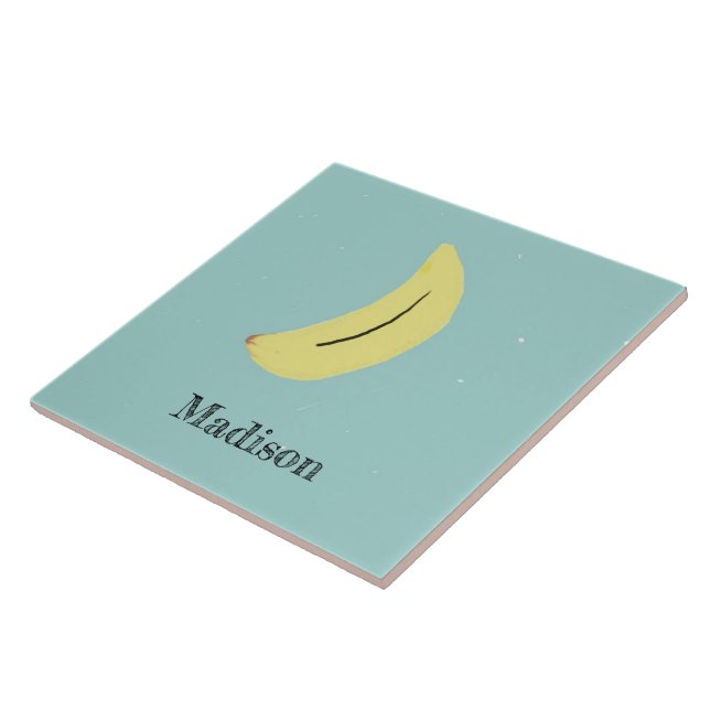 Custom name painted banana on blue tile (Side)