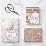 Custom Names Mocha Mousse Brown Wedding Wrapping Paper Sheet<br><div class="desc">Personalized Mocha Mousse Brown elegant floral engagement, wedding or bridal shower wrapping paper with golden and white flowers. Add your own text with easy to use Zazzle editing tool! Modern design in neutral colours. PLEASE NOTE: The gold details are imitation. No actual foil used. Visit the shop to see all...</div>