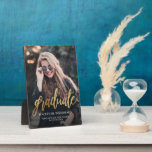 Custom Photo Gold Script Graduation Plaque<br><div class="desc">Modern graduation plaque featuring a custom vertical photo. The word "graduate" appears in gold faux foil script, with the graduate's name, school, and year of graduation below in white sans serif font. Easily replace the sample image with your own graduate's photo. A black gradient screen helps ensure the text pops....</div>