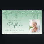 Custom Photo Green Glitter Drip 80th Birthday Banner<br><div class="desc">Welcome guests with this chic, glamourous 80th birthday party photo banner, featuring a sparkly green faux glitter drip border and green ombre background. Easily replace the sample image with a photo of the guest of honour. Personalize it with her name in green handwriting script, with the birthday and date below...</div>