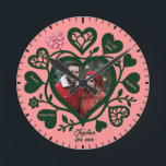 Custom Pink Green Photo Heart Clock<br><div class="desc">This unique wall clock is special because it transforms a standard timepiece into a cherished romantic keepsake by featuring your favourite couple's photo at the heart of the design. Set against a soft pink background with deep forest green decorative hearts and customizable names, it tells a distinctive story of love...</div>