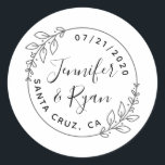 Custom Round Laurel Wreath Wedding Save The Date Classic Round Sticker<br><div class="desc">Create your own unique thank you favours for all your family and friends that joined you on your special day! Add your names, your wedding date, and your wedding location and see your thank you stickers come to life! This design features a simple round frame with two laurel wreath sprigs...</div>
